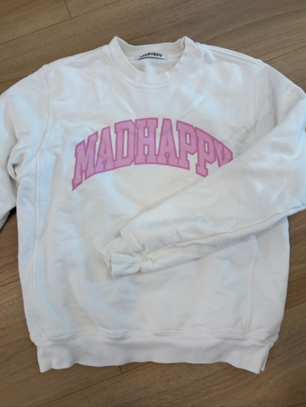 Madhappy White Crewneck Sweatshirt with Pink Logo Arch